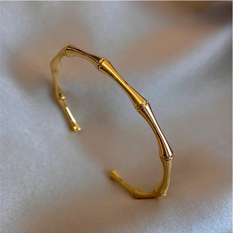 Fashion model showcasing gold bamboo bracelet