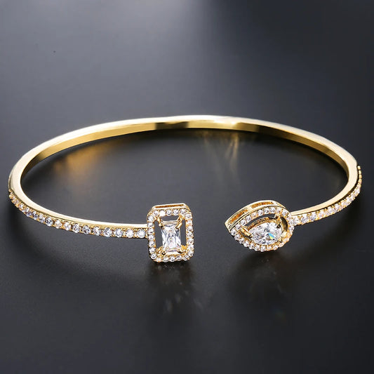 Geometric gold color cuff bangle with cubic zirconia